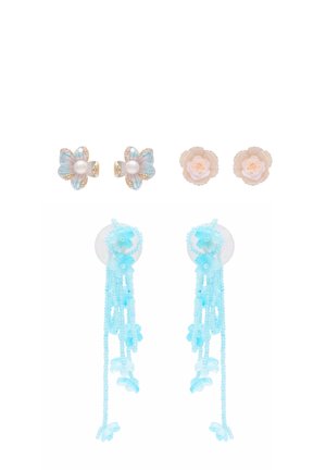 Three pairs of earrings: top left blue and gold flower studs with pearls, top right beige rose studs, bottom long dangling light blue beads and flowers.