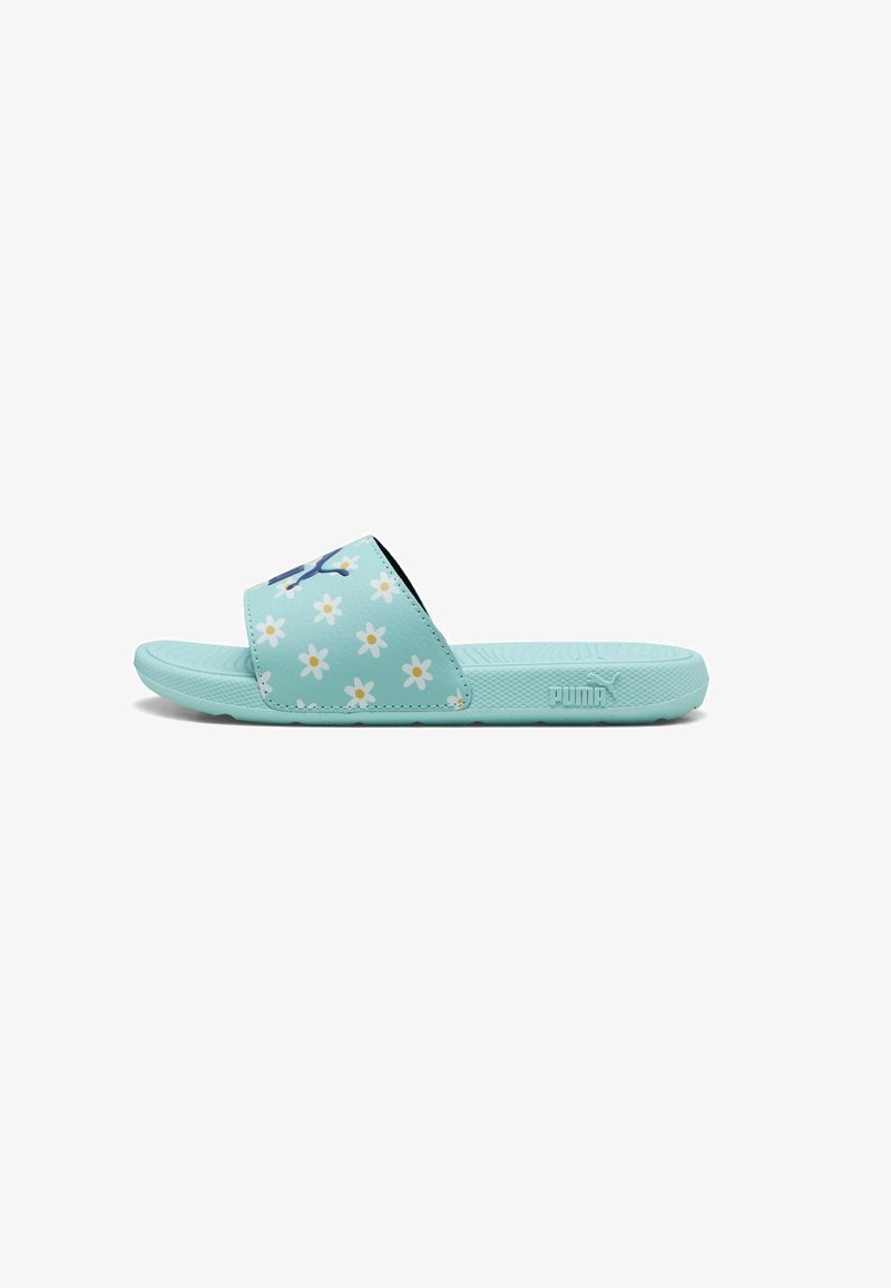 Mint green slide sandal with floral pattern and black accents. Textured outsole and a logo on the side. Smooth synthetic material.