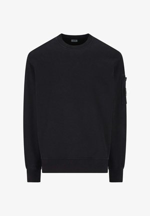 Felpa nera in una morbida miscela di cotone, con collo a giro, maniche lunghe, polsini a coste e una tasca laterale con chiusura a bottone.