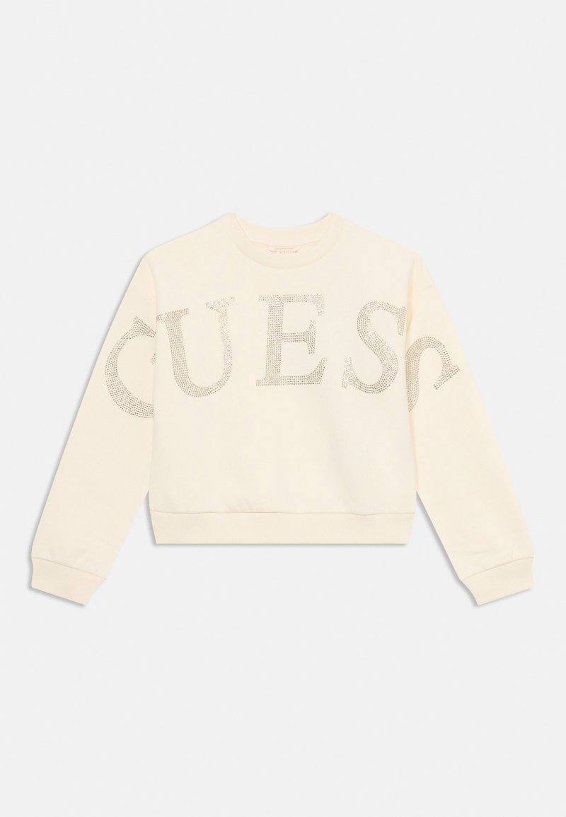 Cream-colored sweatshirt made from soft fabric featuring large, sparkly silver lettering spelling "QUEST" across the front.