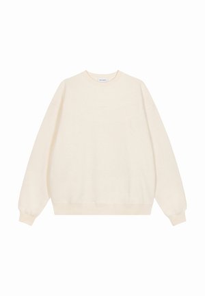 Sweat-shirt crème à manches longues avec col rond, poignets et ourlet côtelés, vue de face sans logos ni motifs visibles.