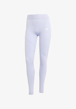 Light purple leggings made of stretchy fabric with a high waistband, featuring a subtle logo and seamless side panel design.