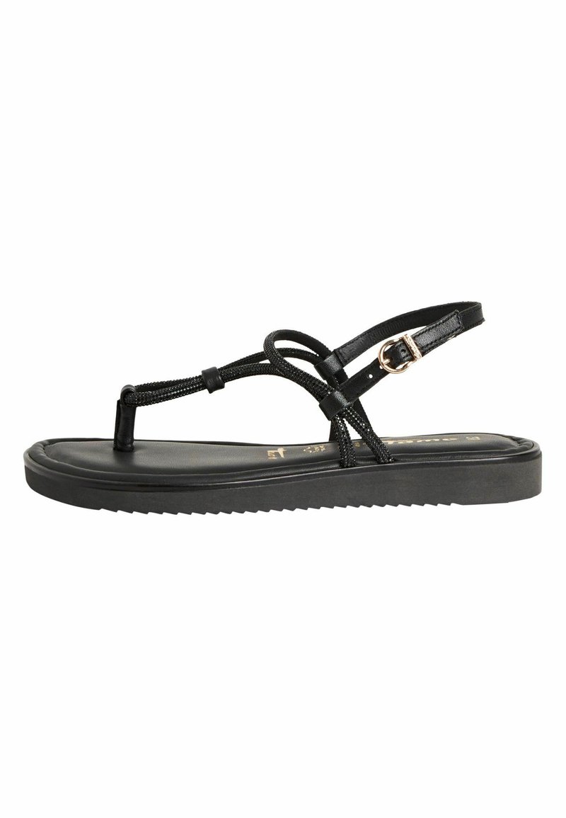 Svarta platta sandaler med ett strukturerat remdesign. Sulan är slät med en lätt upphöjning och räfflad botten för bra grepp. Justerbart spänne.