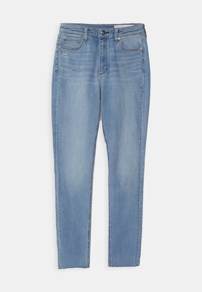 Light blue jeans made of denim. Featuring a straight-leg cut, five pockets, front button closure, and subtle fading near the hips.