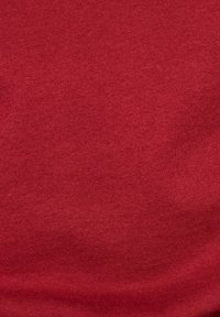 Red knit fabric with a smooth texture, featuring a consistent ribbed pattern throughout. No visible patterns or accents.