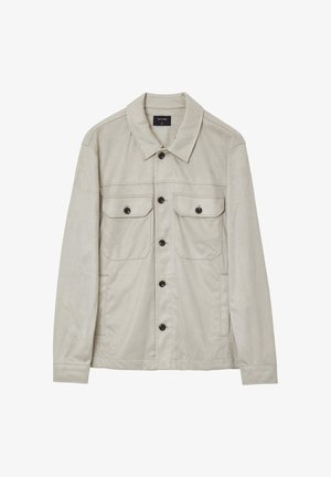 Veste beige clair en tissu texturé. Dotée d'un col, de deux poches poitrine et de quatre boutons à l'avant. Manches longues avec des poignets à boutons.