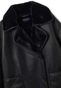 Black leather coat with a plush navy collar, featuring two front pockets and button closure. Smooth texture with a clean design.