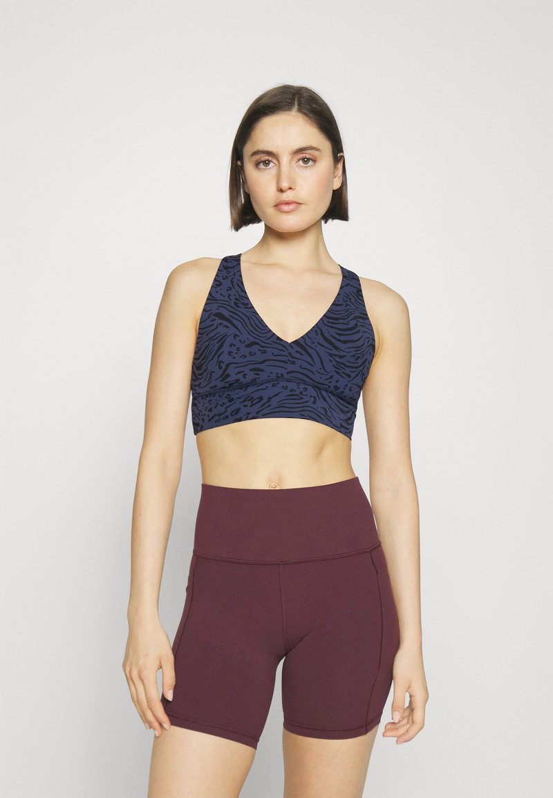 Athleta TRANSCEND PLUNGE BRA AC Sportmelltartó könnyű sportoláshoz