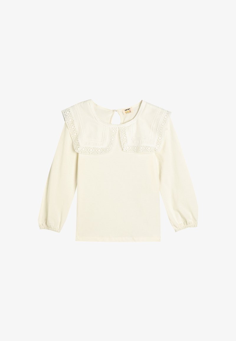Top a maniche lunghe crema con colletto ricamato, apertura a goccia sul retro e polsini arricciati. Morbido cotone misto con delicate rifiniture in pizzo.