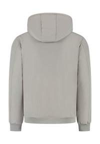 Lichtgrijze capuchonjack van soepel stof, met ribbels aan de manchetten en onderkant, een gestikte capuchon en een naadloos ontwerp aan de achterkant.