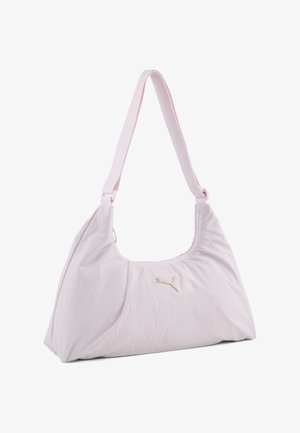 Sac à bandoulière Puma rose clair avec une sangle ajustable unique et un petit logo Puma au centre devant.