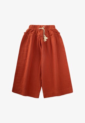 Pantalóny v rustikálnej farbe, skráteného strihu, vyrobené z ľahkej látky, s elastickým pásom a šnúrkou na stiahnutie a dekoratívnymi pompónmi.