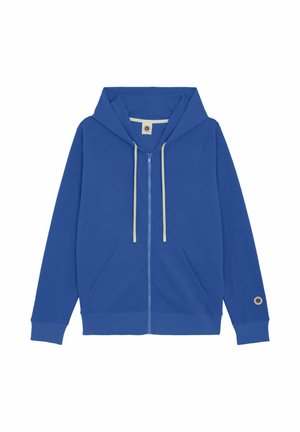 Sweat à capuche bleu avec fermeture éclair, poches avant, cordons de serrage crème, poignets côtelés et un patch circulaire près du poignet gauche.