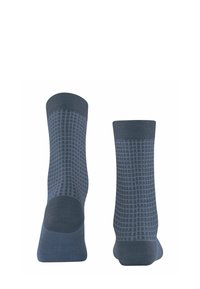Calze di colore blu scuro con un motivo a griglia di blu più chiaro, polsini a coste e superficie liscia. Lunghezza alla caviglia con tallone e punta rinforzati.