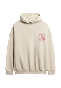 Beżowa, oversize'owa bluza z kapturem wykonana z miękkiego materiału, z różowym logo graficznym na przodzie, kieszenią kangurką oraz ściągaczami przy mankietach i u dołu.