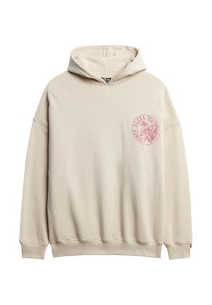 Beige oversized hoodie lavet af blødt materiale med et frontgrafiklogo i pink, kangaroo-lomme og ribbede manchetter og kant.