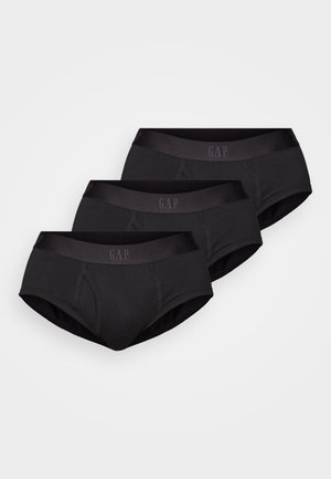 Trīs iegarenas melnas kokvilnas apakšveļas komplekti ar gludu, elastīgu jostu, kurā ir "GAP" logo tumšākā melnā tonī.