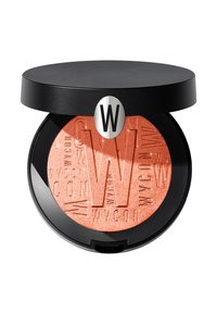 Compact rotondo con un coperchio nero, contenente una polvere arancione in rilievo all'interno. La polvere ha una brillantezza e mostra il logo del marchio.