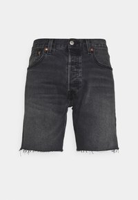 Mustat farkkushortsit, joissa on raakat ja repsottavat reunat, viisi taskua, vyölenkit sekä edessä nappi- ja vetoketjukiinnitys.