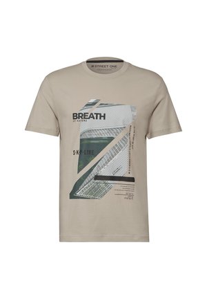 T-shirt beige à manches courtes avec imprimé architectural géométrique et texte incluant "BREATH," "SKY-LINE," ainsi que les coordonnées à l'avant.
