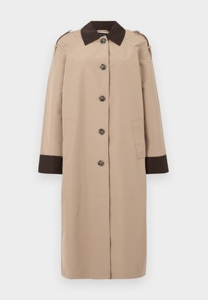 Beige long coat with dark brown collar and cuffs, front button closure, shoulder straps, and two side pockets, displayed on white background.