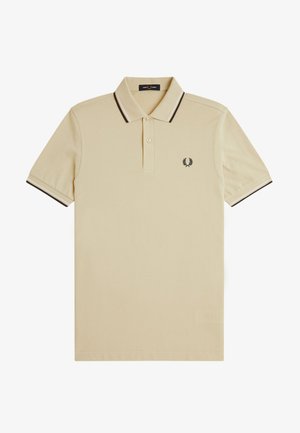 Polo beige a maniche corte con colletto e maniche con bordo nero, abbottonatura a due bottoni e piccolo logo corona d'alloro nero sul petto.