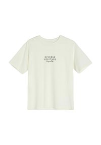 Jasna kremowa koszulka z krótkim rękawem i okrągłym dekoltem. Na koszulce w czarnym kolorze nadrukowany tekst "DIVERSE HERITAGE Original". Prosty design.