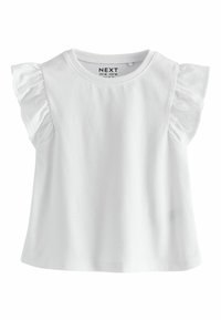 T-shirt blanc à manches courtes pour tout-petit avec manches volantées et col rond, devant uni et étiquette de marque visible à l'intérieur du col.