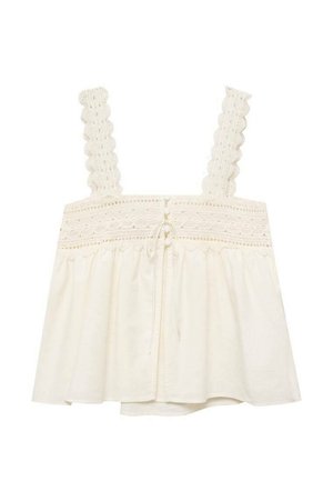 Witte mouwloze top met geschulpte kanten bandjes, een geplooide bovenkant en een losse, uitlopende zoom met een gestrikt detail aan de achterzijde in het midden.