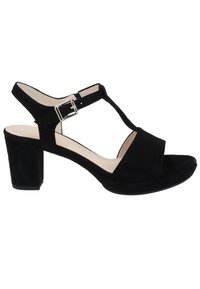 Černé semišové sandály na podpatku s T-řemínkovým designem, nastavitelnou sponou a masivním blokovým podpatkem. Měkká stélka a hladká podšívka.