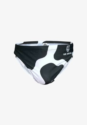 Bañador tipo slip con estampado en blanco y negro, diseño de talle bajo, tejido suave, costuras cosidas y un logo en el lado izquierdo.