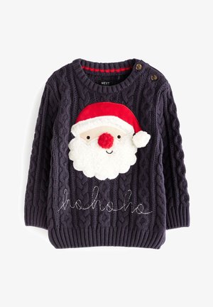 Gros plan sur un pull sombre tricoté avec un visage de Père Noël texturé, comprenant un chapeau rouge, un nez rond rouge, une barbe blanche duveteuse et un pompon.