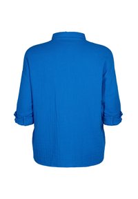 Blue lightweight shirt with a soft texture, a collar, and roll-up sleeves. The back features a pleated design for enhanced comfort and fit.