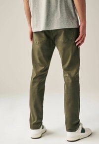 Next AUTHENTIC - Blugi conici - mottled green