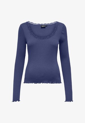 Marineblauwe geribbelde langemouwen top met een gegolfde kantenkraag en een rimpelzoom, gemaakt van rekbare stof voor een aangesloten pasvorm.