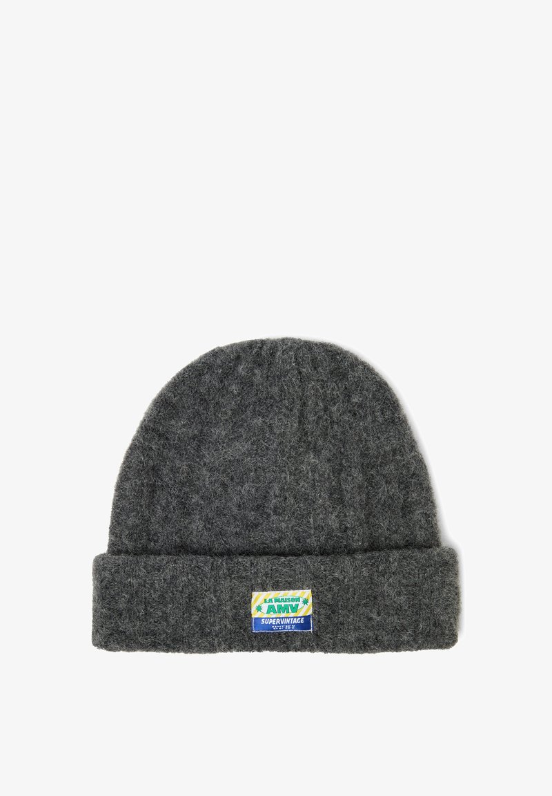 Gray wool knit beanie with a folded cuff. Features a colorful brand patch labeled "LA MAISON AMI" with a vintage design. Soft texture.
