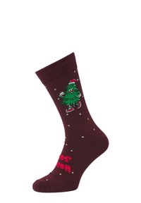 Chaussettes bordeaux avec un motif d'arbre de Noël vert portant un chapeau de Noël rouge, agrémentées de pois blancs et du texte "Joie" en rose. Tissu tricoté.