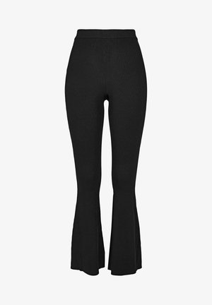 Črne rebraste hlače s širokimi nogavicami in visokim pasom, ki imajo teksturirano tkanino in oprijeto silhueto, ki se na robu razširi.