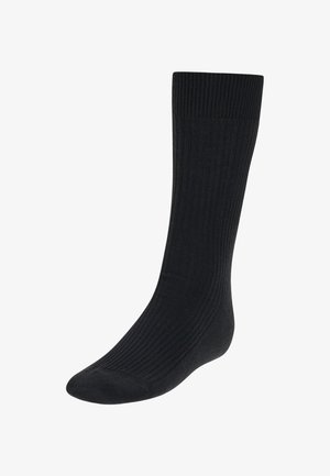 Schwarze gerippte Socken mit glatter Textur, in mittlerer Wadenhöhe und verstärktem Zehenbereich. Einfaches Design ohne ausgeprägte Muster oder Akzente.
