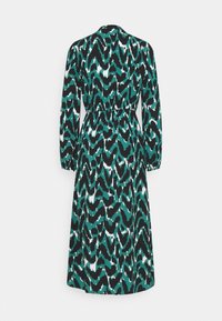 Robe midi à manches longues avec imprimé animal abstrait bleu sarcelle, noir et blanc, taille froncée et jupe légèrement évasée vue de dos.