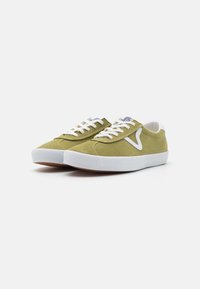 Green suede sneakers with white rubber sole, featuring white laces, a contrasting logo, and a rounded toe design.