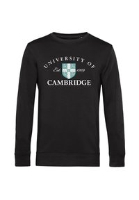 Černá mikina s dlouhým rukávem, zdobená textem "Univerzita v Cambridge", datem založení a designem štítu v tyrkysové a bílé barvě.