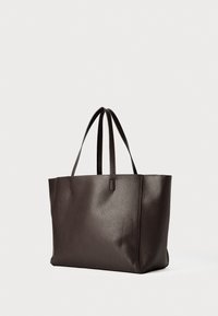Dark brown textured leather tote bag with double shoulder straps, spacious rectangular shape, and a simple design on a plain background.