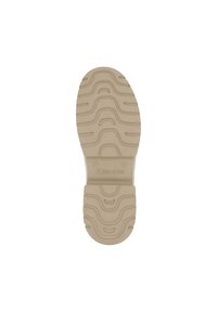 Semelle de chaussure en caoutchouc beige avec des rainures et crêtes texturées ; présente un logo central et un numéro de modèle, conçue pour l'adhérence et la durabilité.