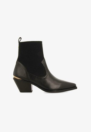 Stivaletto nero alla caviglia con punta affilata, parte superiore in tessuto a coste, tomaia in pelle e tacco basso a blocco con un accento dorato.