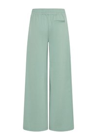 Mintgroene, wijde broek met een elastische tailleband en één achterzak. Zachte textuur en eenvoudig ontwerp, geschikt voor casual draag.