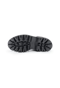 Suola di scarpa in gomma nera con scanalature profonde, superficie testurizzata e design sagomato, con le indicazioni delle taglie visibili.