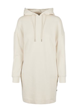 Robe sweat à capuche crème en coton doux, avec une poche kangourou, une capuche avec cordon de serrage et des poignets côtelés. Coupe légèrement oversize avec des fentes latérales.