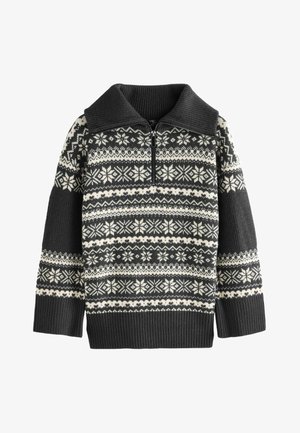 Knit sweater with a high, ribbed collar, featuring a zip closure. Black and white Fair Isle pattern, textured sleeves, and ribbed hem.