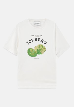 White cotton t-shirt featuring a graphic of iceberg lettuce, with black text reading "THE TASTE FOR ICEBERG" and "Since 1974."
